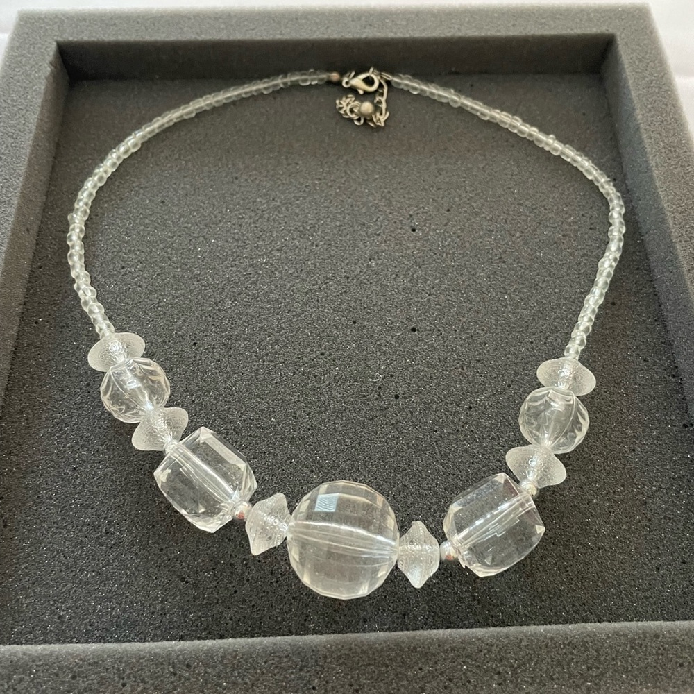 Clear necklace. Looking almost like a crystal. In Good conditions.